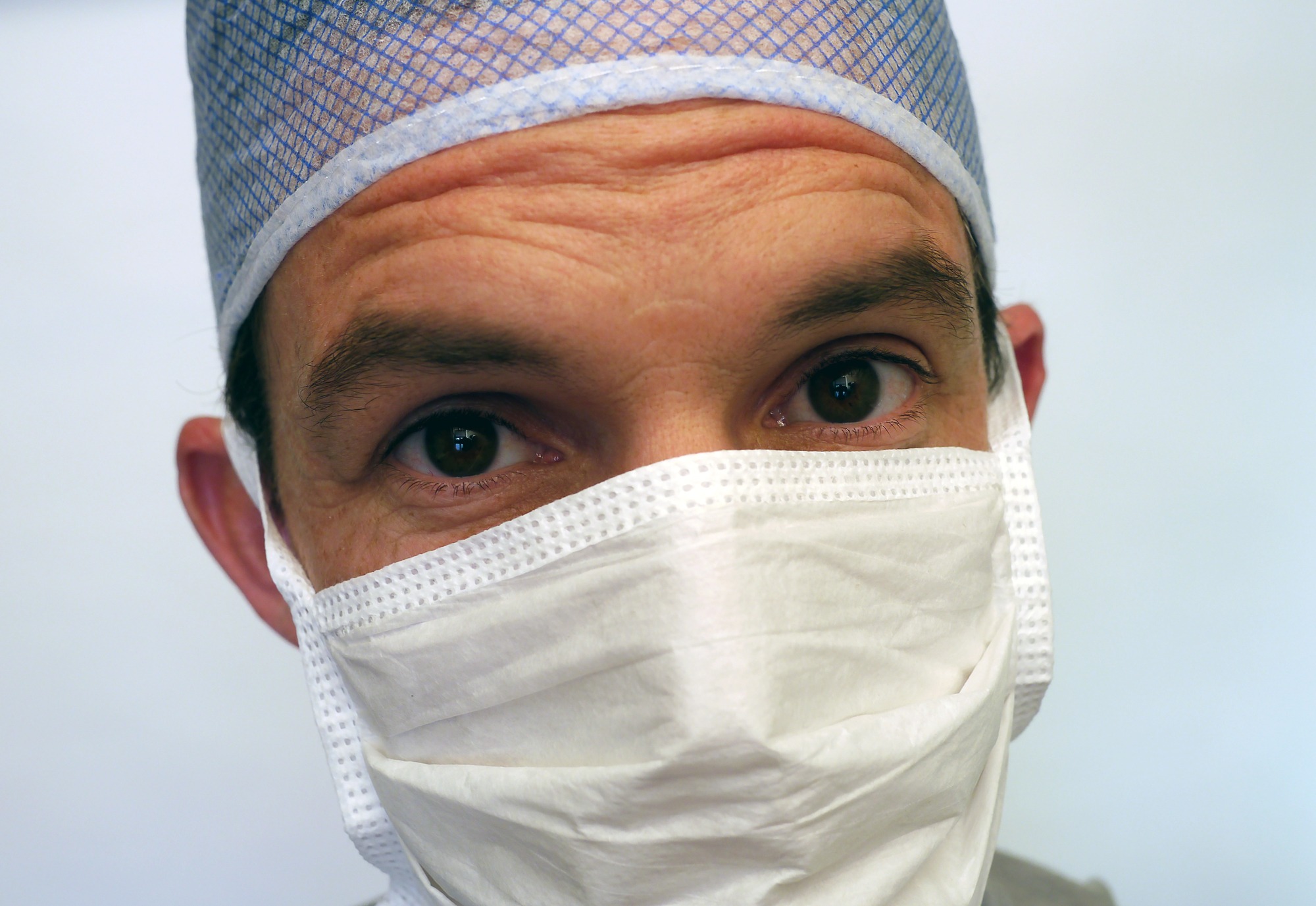How Temporal Migraine Surgery Is Performed Plastic surgeon preparing to perform temporal migraine surgery